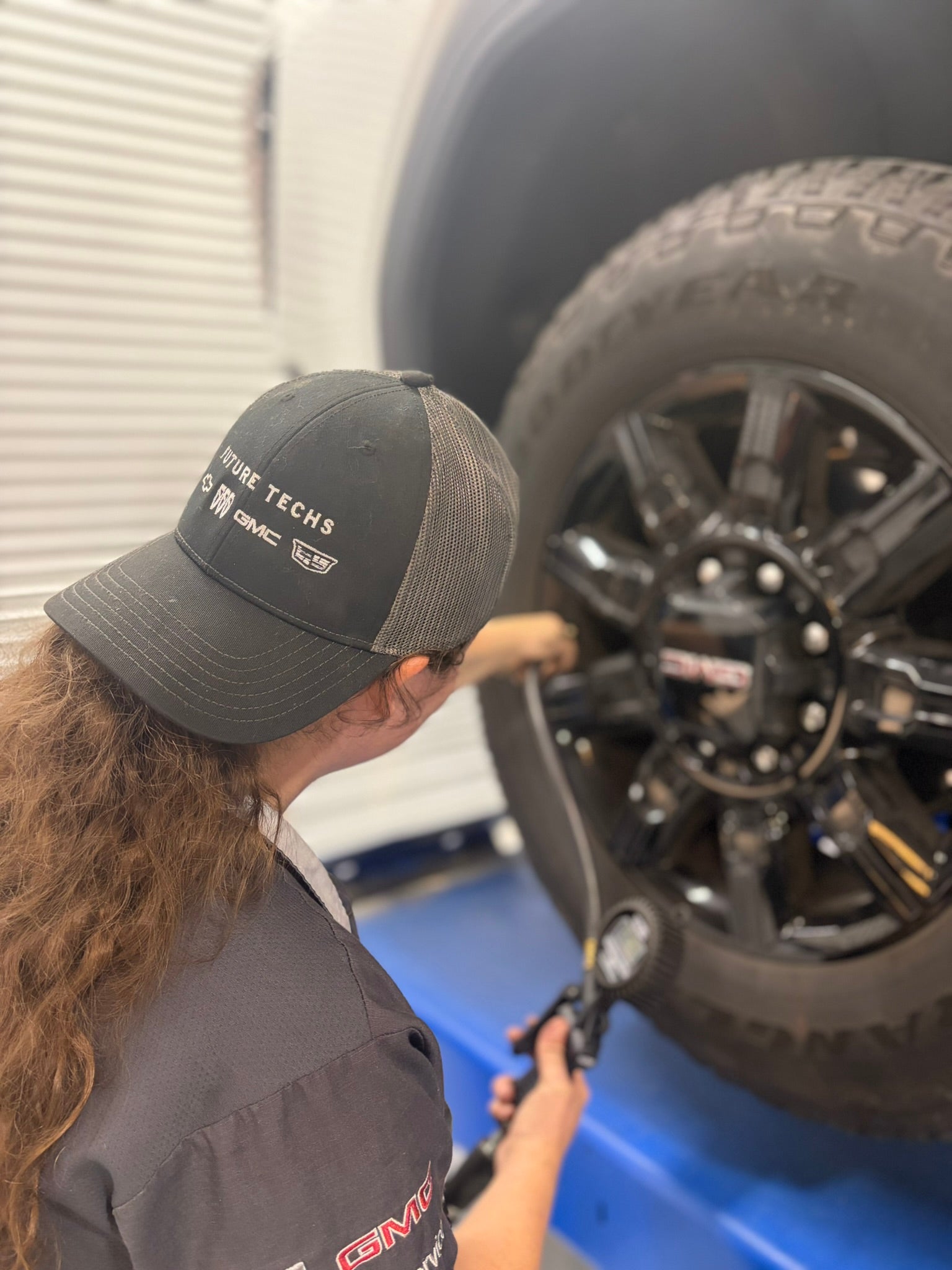 McConnell Automotive Athena checking tire pressure in Mobile AL